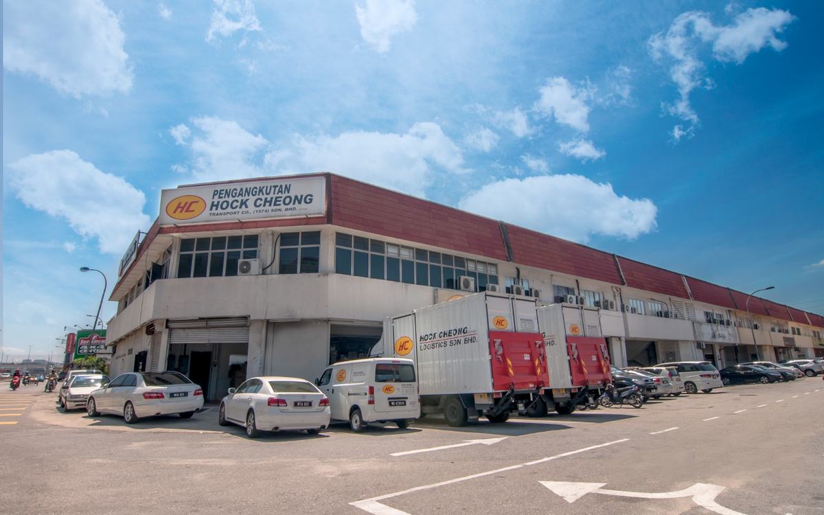 The Hock Cheong Group HQ office with HC-liveried box trucks and vans parked in front